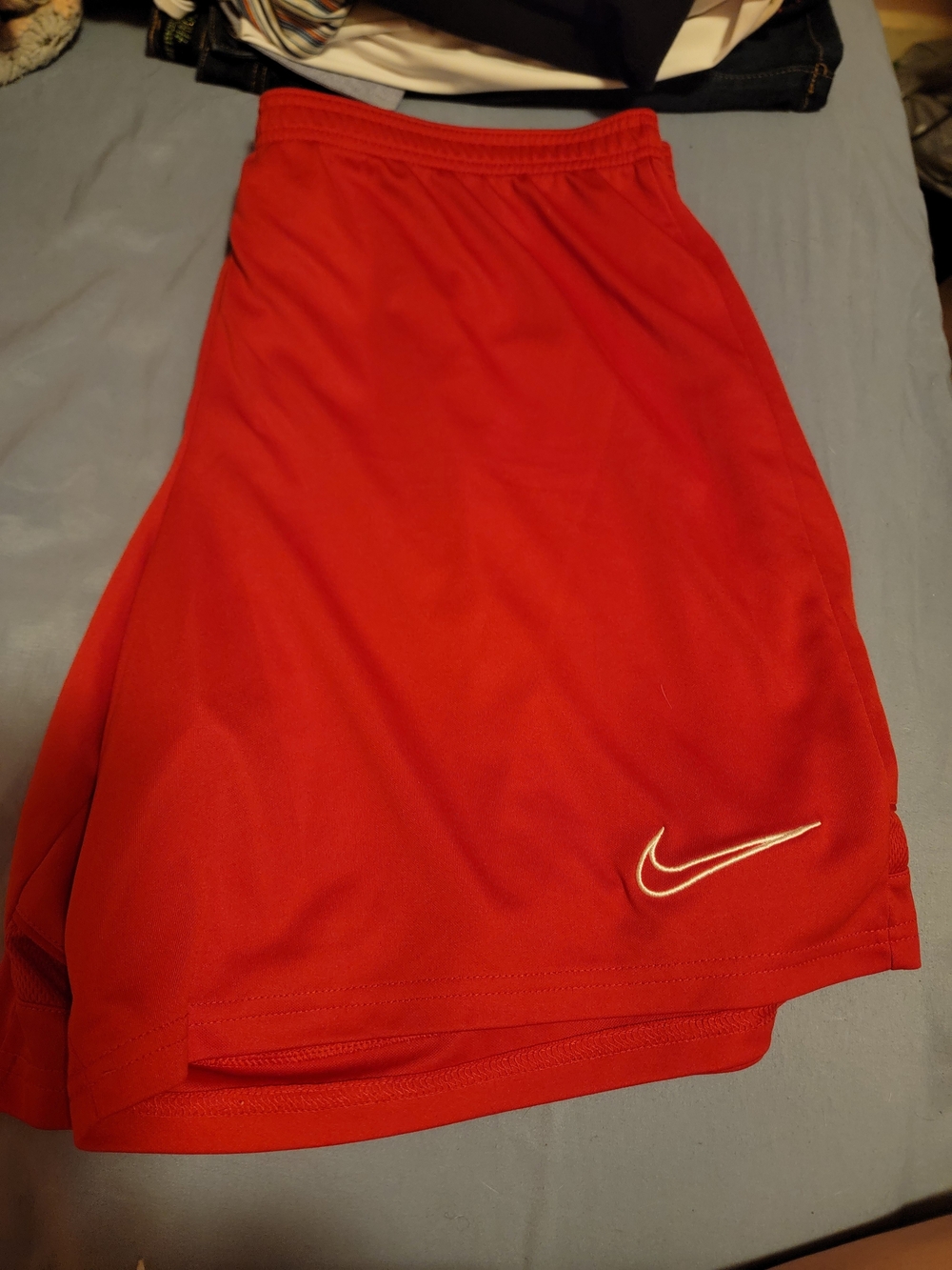 Nike Red Athletic Shorts with White Swoosh